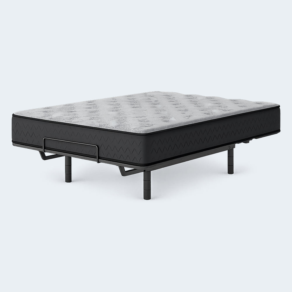 High-angle studio view of the Comfort Plus 10 Inch Medium Mattress on a raised adjustable base for targeted pressure relief and customized support.
