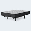 High-angle studio view of the Comfort Plus 10 Inch Medium Mattress on a raised adjustable base for targeted pressure relief and customized support.
