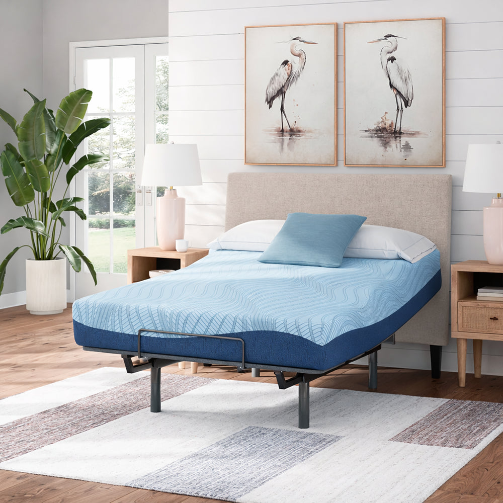 Frontal view of the Ashley Peak 2.0 8-inch firm memory foam mattress styled in a serene bedroom with modern bird artwork.
