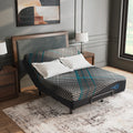 Millennium 2.0 Hybrid Plush Mattress by Ashley shown on a raised adjustable base for customized comfort and targeted pressure relief.
