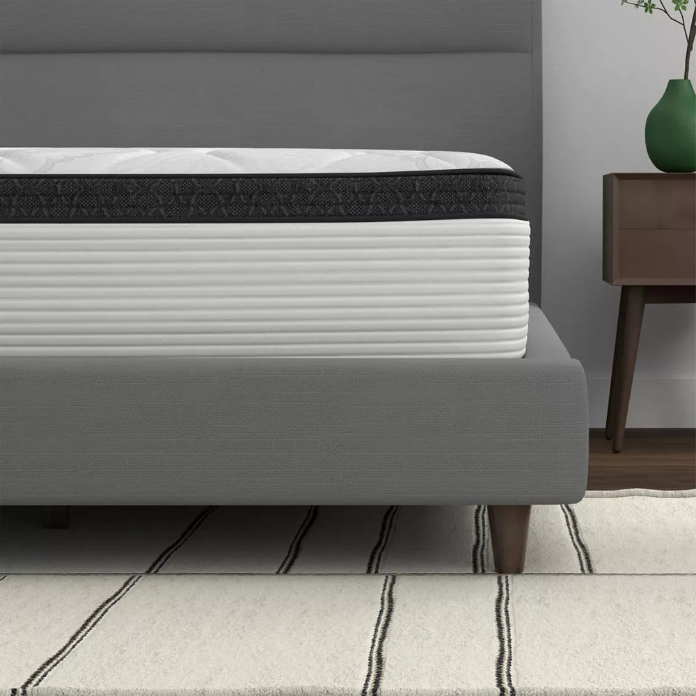 Detailed side profile of the 12-inch American Bedding Cymbal Jingle Hybrid Mattress highlighting the thick Euro top layer and striped side panel design.
