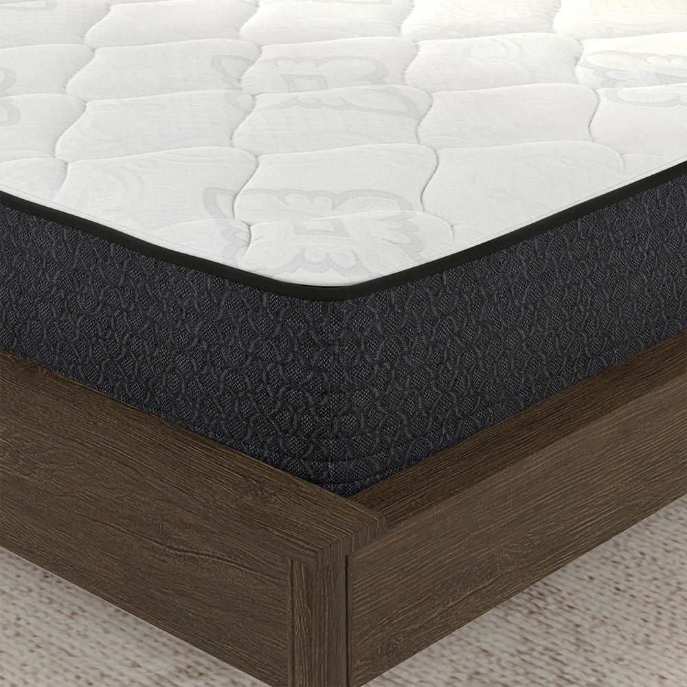 Close-up corner view of the American Bedding Classic 8 Inch Mattress featuring a white quilted top and durable dark grey textured side panels.
