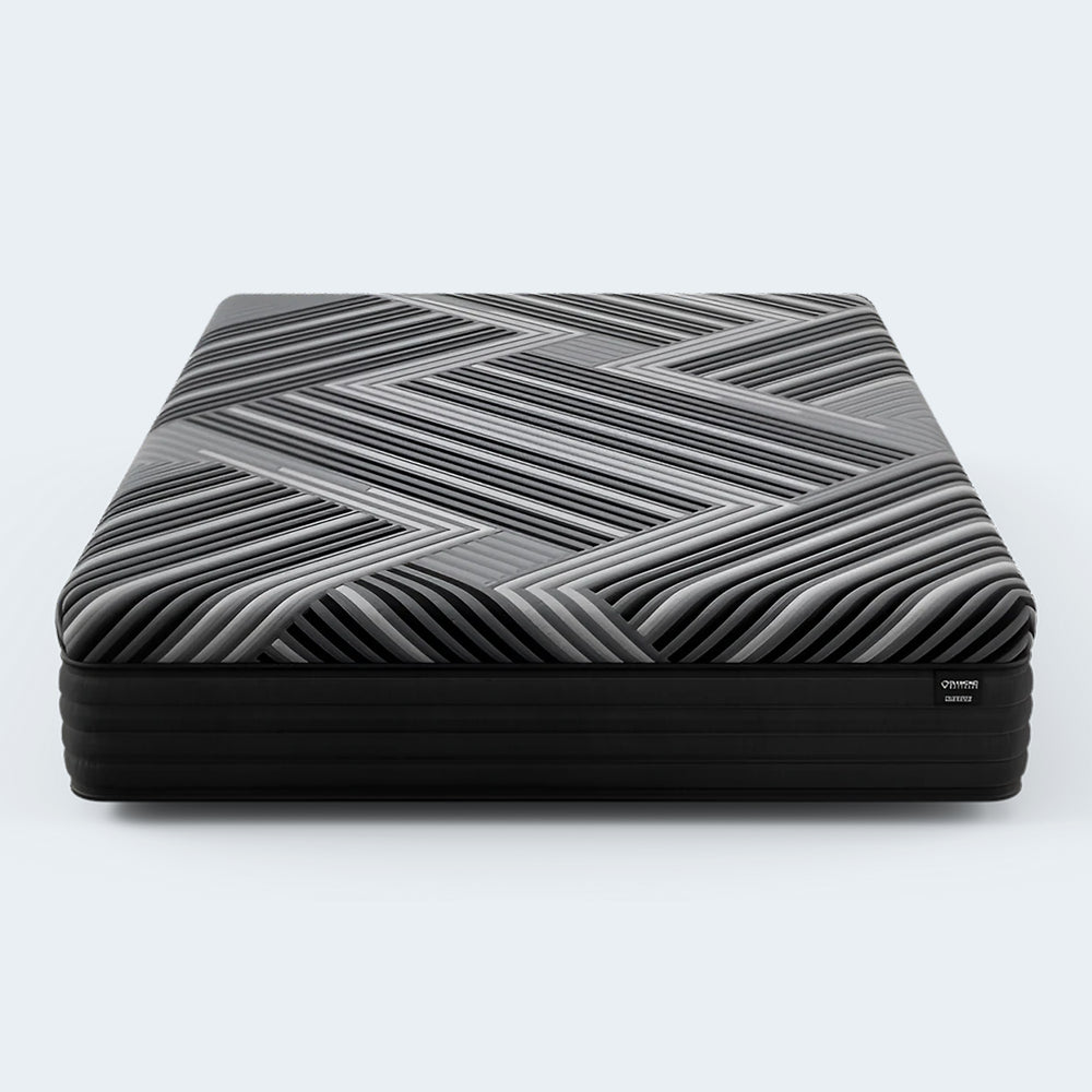 Front view of the Diamond Mattress Dreamstage 2.0 Calm Hybrid 14-inch mattress featuring a bold black and grey chevron cooling cover.

