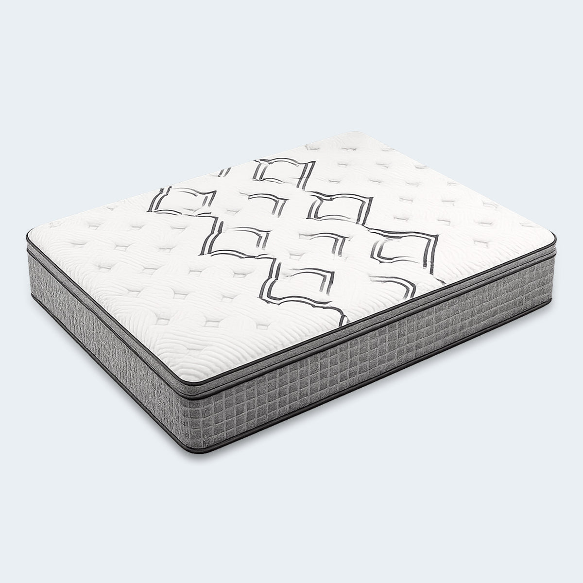 Angled view of the Drift Euro Top Mattress in a studio setting, showing the geometric quilted cover.