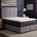 Side view of the 2.5 inch Gel Memory Foam Mattress Topper by Malouf placed on a modern dark grey bed frame.