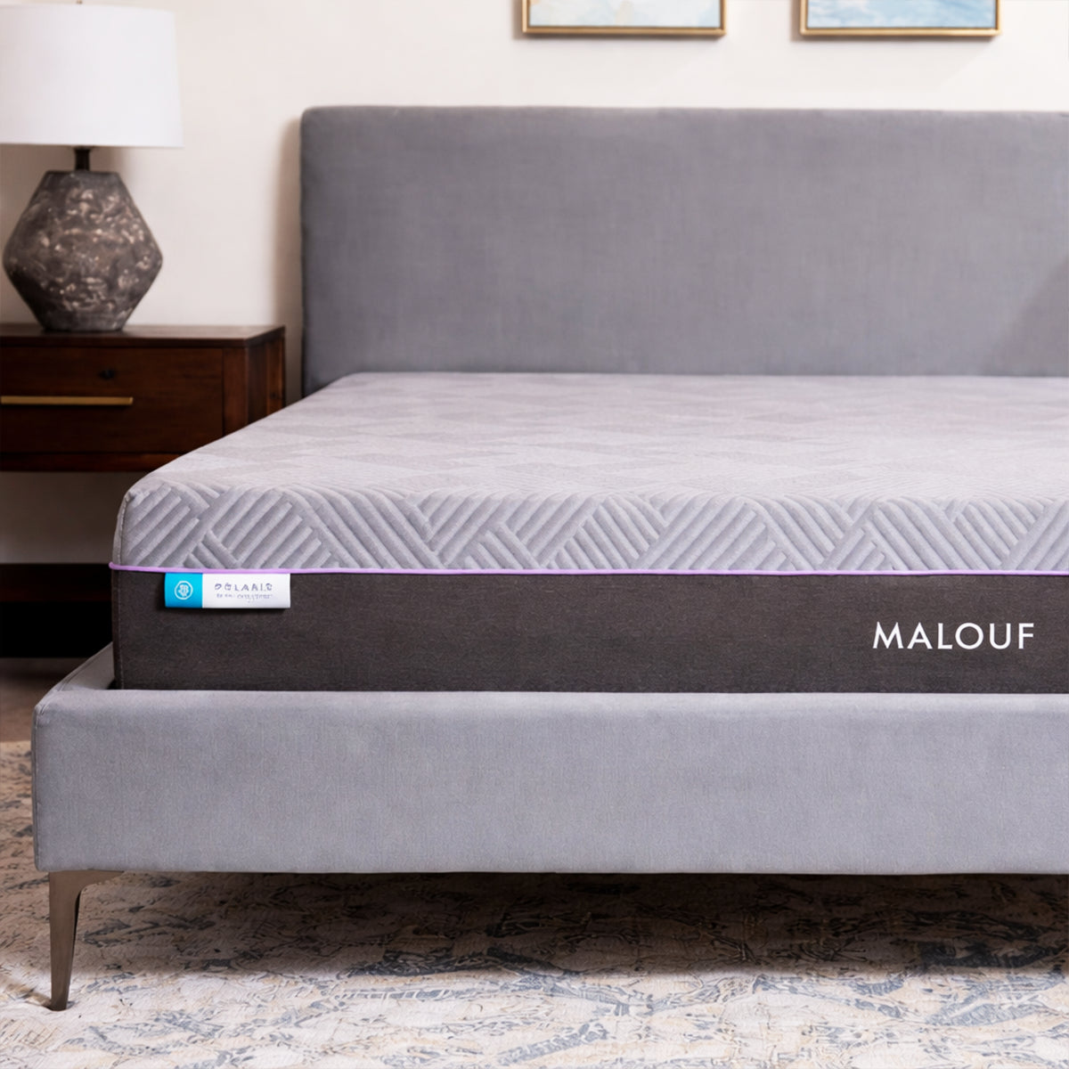 Lifestyle view of a man reading on the Polaris 12" Activair Hybrid Mattress to show comfort and plushness.