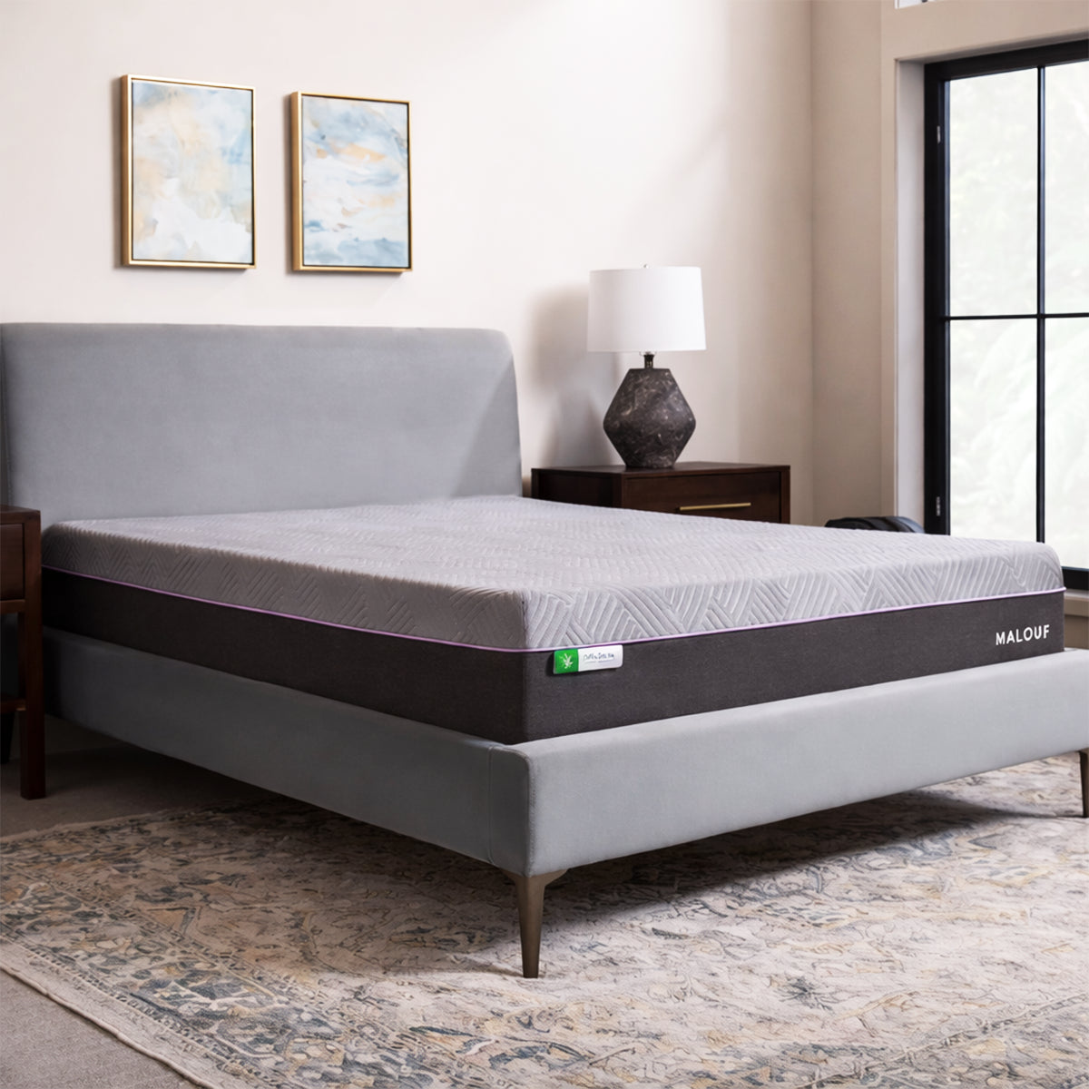 Polaris 12" Aeroflex Hybrid Mattress in a modern bedroom setting on a stylish grey upholstered bed frame.