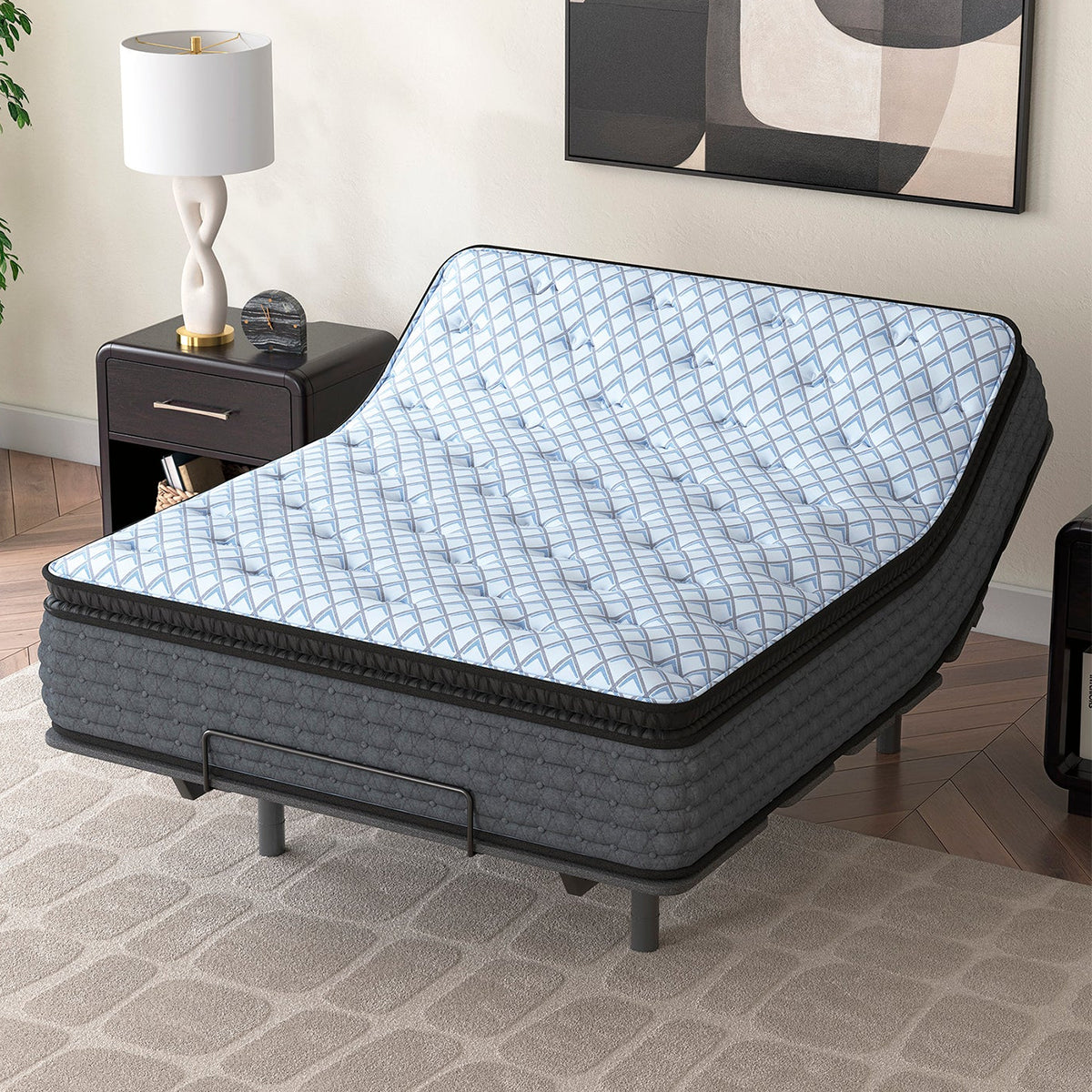 Ashley Destin Cove 15-inch ultra plush mattress with the head section elevated on a power base, demonstrating hybrid flexibility.
