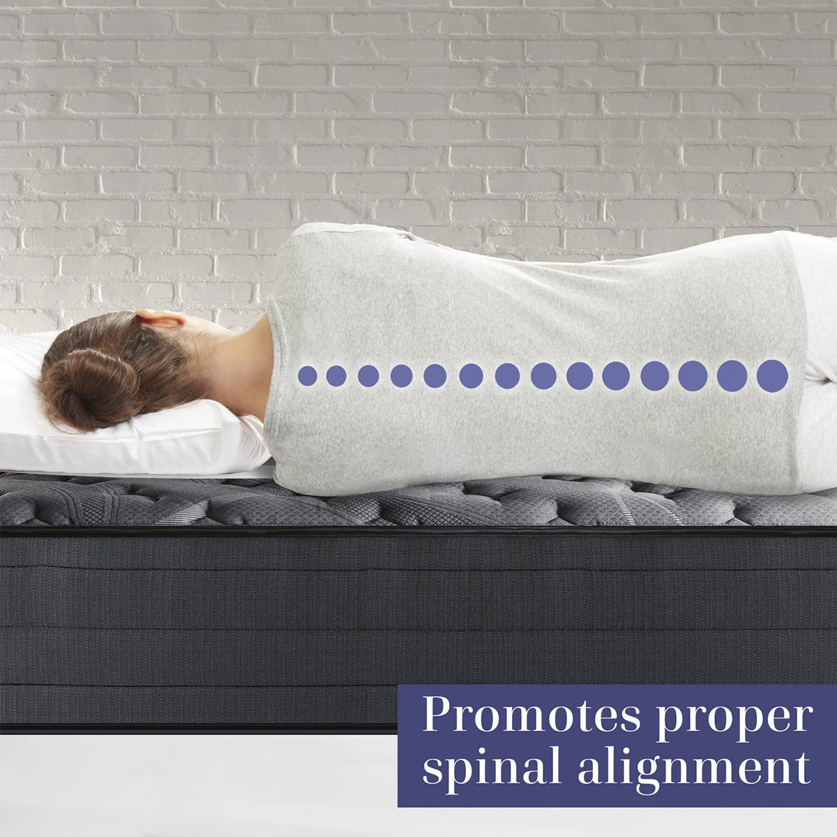 Side view of a person lying on a Corsicana Nights Bridge mattress with a graphic showing how the hybrid design promotes proper spinal alignment.
