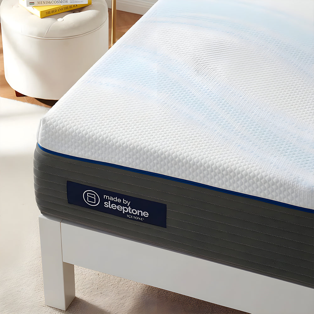 Detailed corner view of the Sleeptone ICETONE cooling mattress cover on a 12-inch memory foam profile with premium blue piping.
