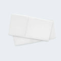 Pair of folded white BEDGEAR Hyper-Wool pillowcases, ideal for sleepers who want natural temperature control.

