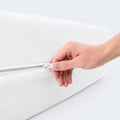Secure zippered closure on Malouf Encase 360 mattress protector to block bed bugs and allergens.