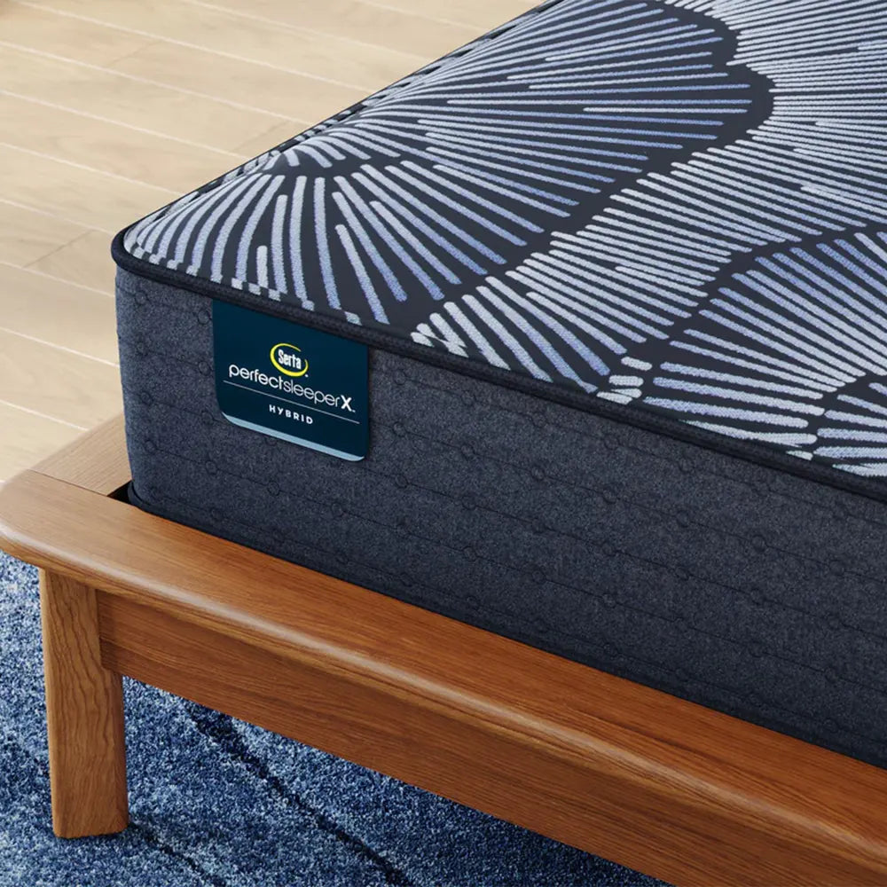 Close-up of Serta Perfect Sleeper X branding on the Knox Firm 13.5 inch hybrid mattress corner.
