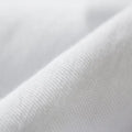 Detailed view of the ultra-breathable Omniphase cooling fabric on a white Malouf mattress protector.
