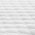 Close-up of the breathable quilted fabric on a Malouf Weekender pillow cover for enhanced airflow.