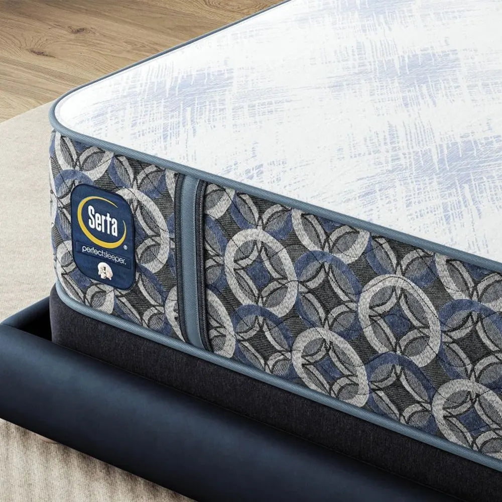 Close-up of Serta Perfect Sleeper logo and patterned side panels on the Cascade Bluff 14.5" Plush mattress.

