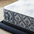 Close-up of the Serta Perfect Sleeper logo and designer pattern on the 14.5" Cascade Bluff Hybrid mattress.
