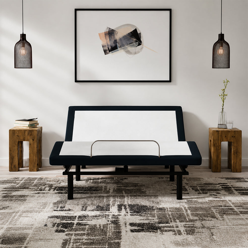 Front-facing view of the SBKDP2 zero-clearance adjustable base with a sturdy mattress retainer bar, styled in a contemporary home environment.
