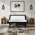 Front-facing view of the SBKDP2 zero-clearance adjustable base with a sturdy mattress retainer bar, styled in a contemporary home environment.
