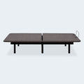 Side profile of the Ashley Comfort Classic adjustable bed base in a neutral flat position showing the low-profile frame and steel legs.

