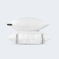 Stacked pillows with white BEDGEAR Ver-Tex cases, featuring branded side panels and heat-deflecting fabric.

