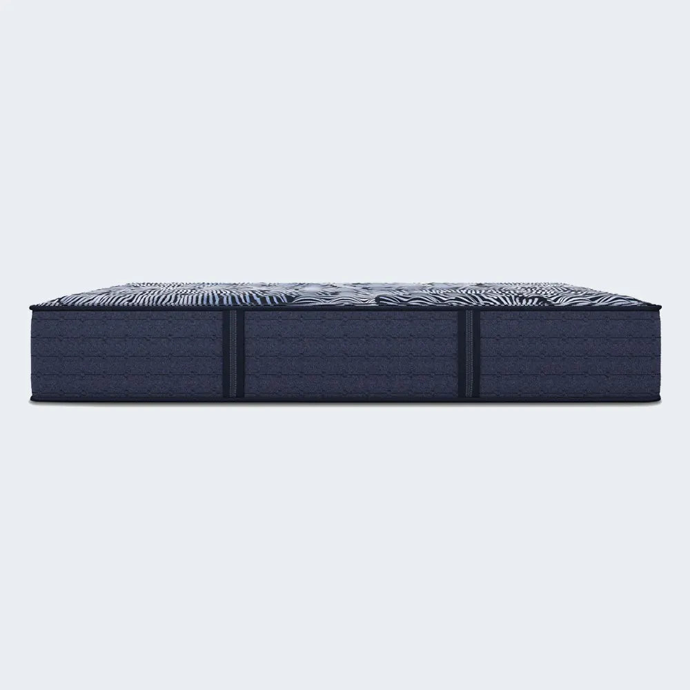 Close-up of the breathable floral quilted fabric on a Serta Perfect Sleeper X Extra Firm hybrid mattress.
