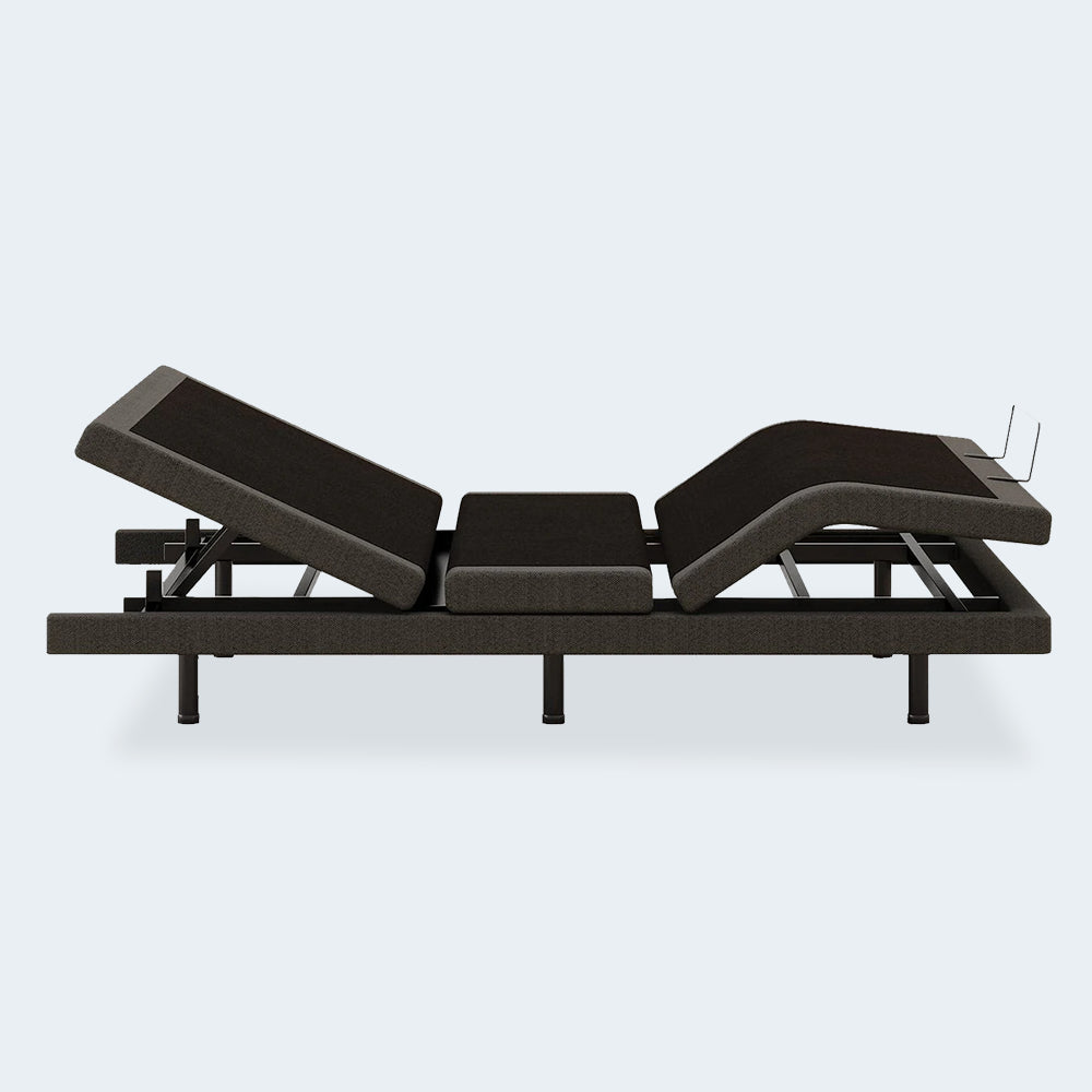 Side profile of the Comfort Ultra motorized bed frame by Ashley in a full upright sitting position for maximum head elevation.
