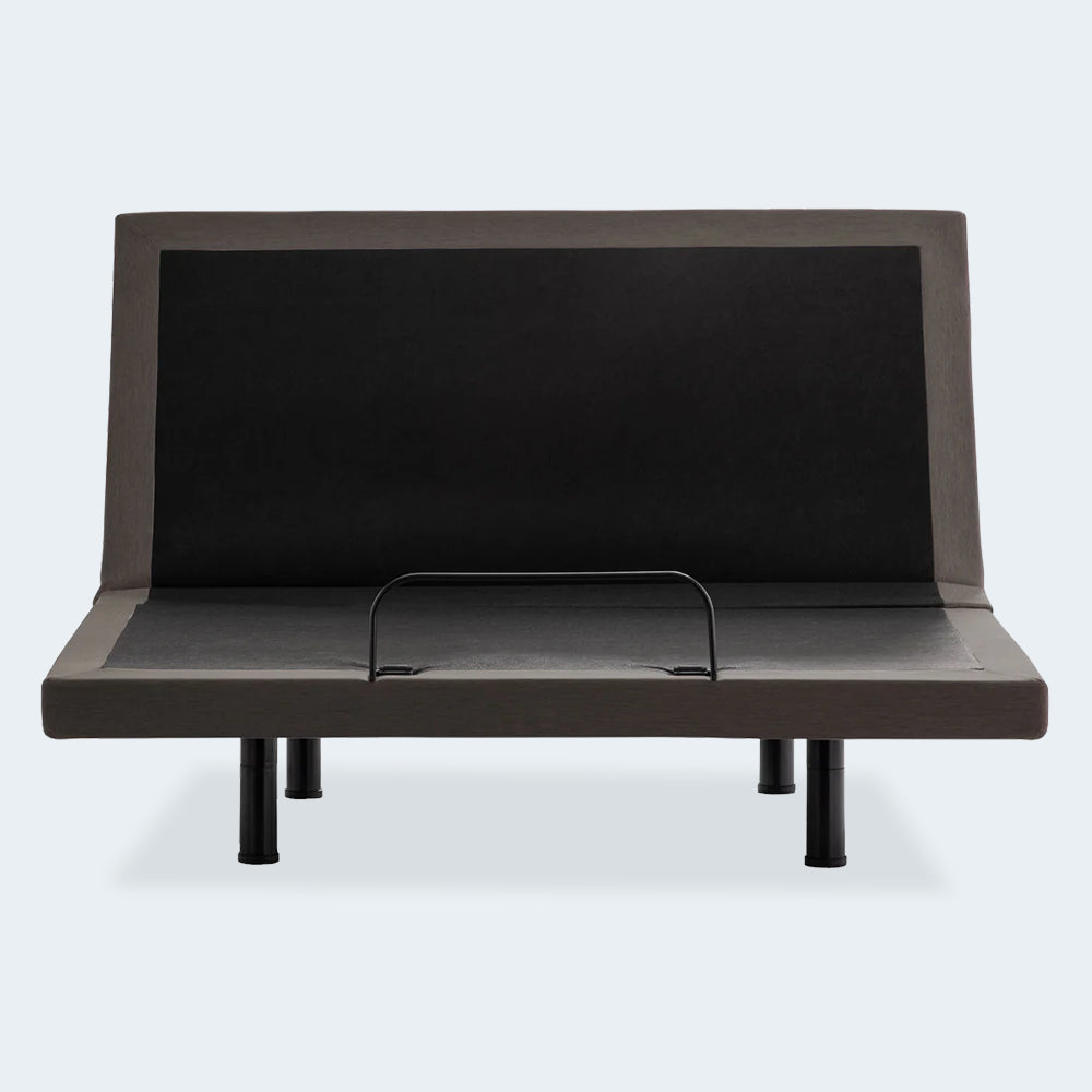 Front-facing view of the Malouf S655 motorized bed base with the head section fully raised and a mattress retainer bar visible.
