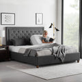 Woman reading in a split king Malouf M555 adjustable bed, demonstrating independent side control for couples.