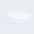 Two folded Malouf Prime pillow protectors in white, providing a clean and fresh sleep surface.
