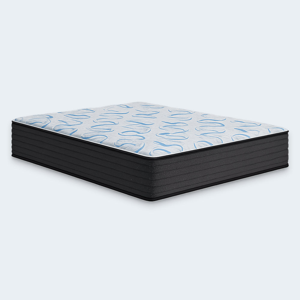 Angled profile shot of the 14-inch Elite Springs firm mattress by Ashley, highlighting the blue and white wave design on the quilted cover.
