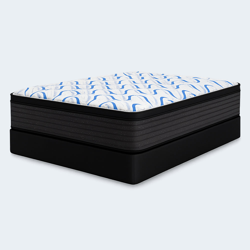 Side angle of the high-profile Elite Springs 14" plush mattress by Ashley paired with a sturdy black foundation box spring.
