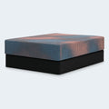Perspective studio shot of the Ashley Furniture 13-inch firm hybrid mattress highlighting the thick comfort layers and durable charcoal side panels.
