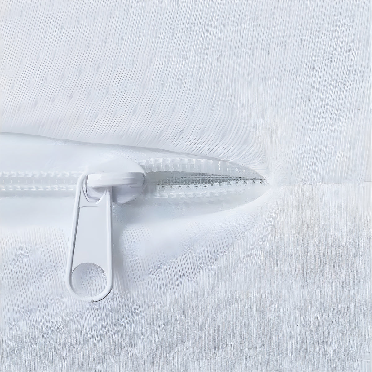 Macro view of an open zipper revealing the breathable interior of the 2-Stage Hybrid Mattress.
