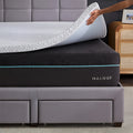 Close-up view of the 2.5 inch Gel Memory Foam Mattress Topper cover being lifted to show plush quilted fabric.