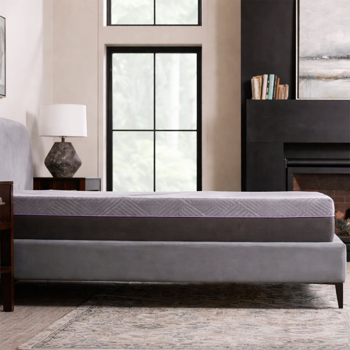 Side profile of the Polaris 12" Coolsync Hybrid Mattress in a modern bedroom setting on a grey upholstered bed frame.