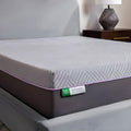 Close-up corner of the Polaris 12" Aeroflex Hybrid Mattress with the branded tag and purple accent piping.