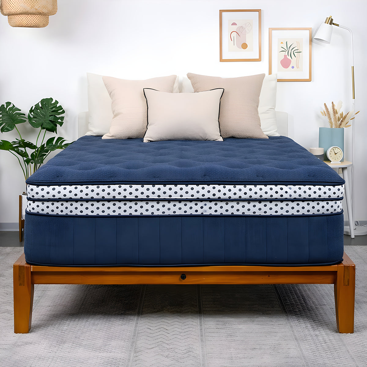 Front view of the WinkBeds Blue Mattress on a wood frame highlighting the 17-inch luxury firm profile.