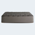 Profile view of the Tommie Copper Core Znergy 14-inch plush hybrid mattress featuring charcoal grey fabric and copper trim.
