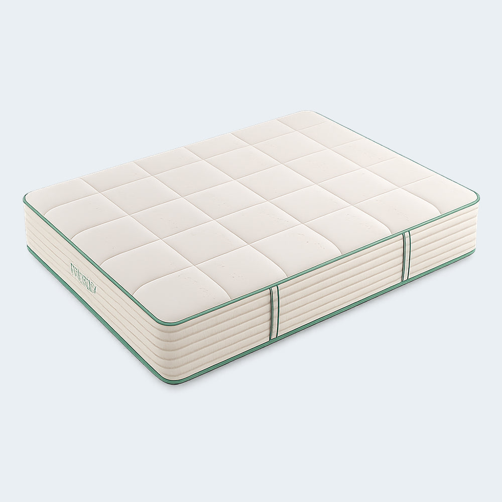 Three-quarter angled view of the Sage Organic Latex 12-inch medium mattress with cream block-quilted fabric and green edge piping.
