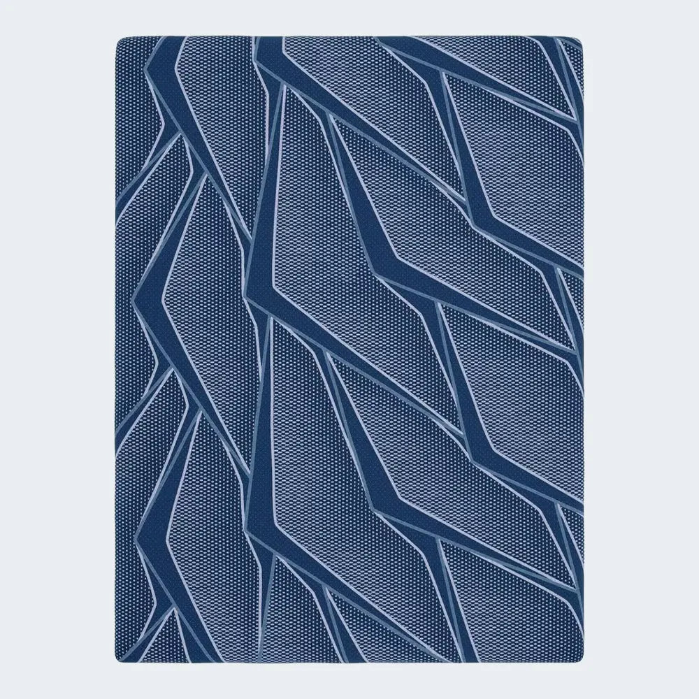 Top-down view of the breathable geometric cooling cover on a Serta iSeries NXG 1500 mattress.
