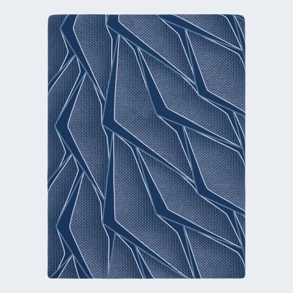 Close-up of Serta iSeries NXG 2500 branding and premium quilted fabric on a 12.5" hybrid mattress.
