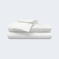 Stacked white BEDGEAR Ver-Tex cooling sheet set for a breathable, moisture-wicking sleep experience.
