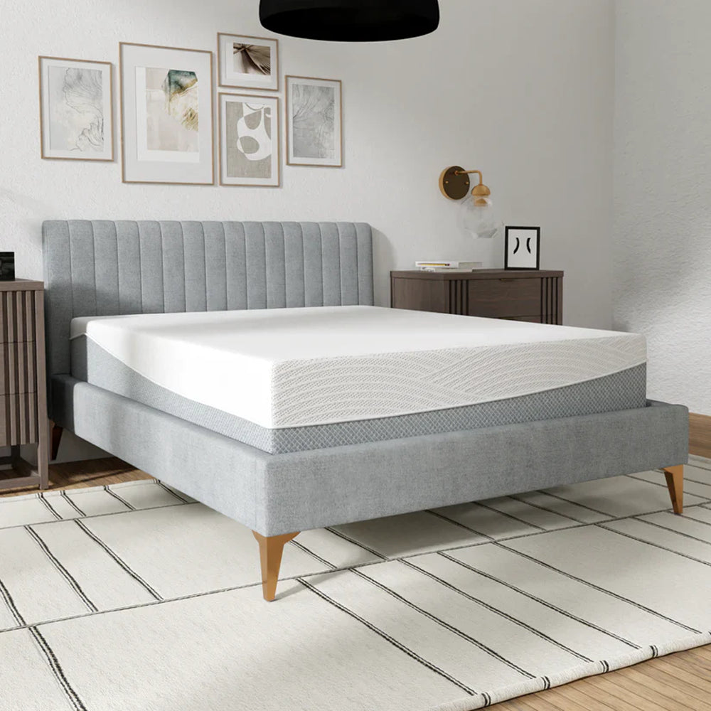 Three-quarter perspective of the 12-inch EcoCore Hybrid Deluxe mattress showcasing the white breathable top and grey patterned side fabric.
