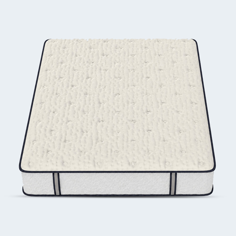 Top-down studio perspective of the Sofinity Hybrid Signature mattress highlighting the tufted quilted cooling cover.
