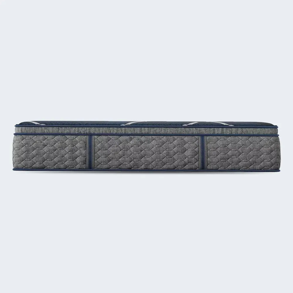 Profile view of the 14 inch Beautyrest World Class Hybrid Medium Pillow Top mattress with side handles.
