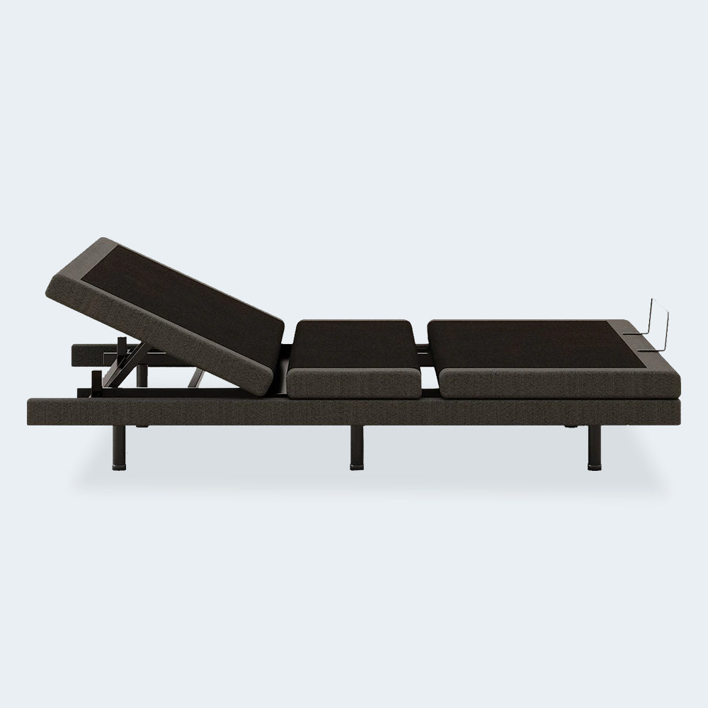 Side view of the Comfort Ultra Adjustable Base by Ashley showing head-up articulation for reading or anti-snore relief.
