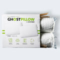 GhostPillow 2-pack unboxing showing compressed queen-size memory foam pillows in retail packaging.
