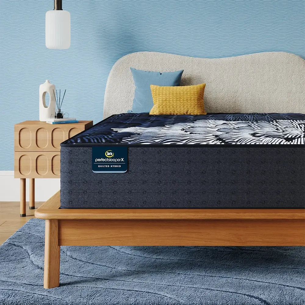 High-profile Serta Perfect Sleeper X Max Medium Hybrid Mattress styled with pillows in a cozy bedroom.
