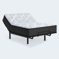 Ashley Elite Springs 14-inch firm mattress with the head section elevated on a modern adjustable power base for reading or watching TV.
